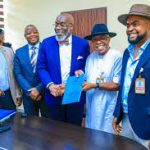 The Enugu State Government has entered into a N100 billion joint venture agreement to revive the long-abandoned Heneke Integrated Farm in Ezeagu Local Government Area, transforming it into a world-class agro-industrial hub. The agreement, signed on Tuesday at the Government House, Enugu, formalised the creation of Enugu Tribu Songhai Farms Ltd, a Special Purpose Vehicle (SPV) that will oversee the rehabilitation, expansion, and management of the 10,000-hectare project. Governor Peter Mbah, represented by the Secretary to the State Government, Prof. Chidiebere Onyia, described the deal as a milestone in Enugu’s push to industrialise agriculture. “Today, we formalise a partnership that will breathe new life into the Enugu Songhai Initiative, transform abandoned assets into thriving agro-industrial hubs, and advance food security, regenerative development, and inclusive growth for Ndi Enugu,” Onyia said. Originally established in 2013 but left incomplete, the farm will now be developed into a multi-sectoral agro-industrial ecosystem. Plans include large-scale crop production, livestock rearing, aquaculture, processing plants, renewable energy systems, and eco-tourism facilities. The project will also feature a 25-hectare training and incubation centre for youth and women, create thousands of jobs across agriculture and export value chains, and promote modern, sustainable farming practices. Commissioner for Agriculture and Agro-Industrialisation, Hon. Patrick Ubru, said Enugu has the resources and manpower to make the initiative a success. “This initiative will create thousands of jobs, boost food production, and change the mindset of our people towards agriculture. It is going to be an integrated system crop, livestock, aquaculture, processing, export, and eco-tourism driven by the community, private sector, and government,” he explained. Prof. Godfrey Nzamujo, Director of Songhai Sustainable Initiative, stressed that the project would leverage integrated farming and renewable energy to ensure efficiency. “We are committed to producing more and better with less. This is about integrated farming that combines crops, livestock, aquatics, renewable energy, and human capital development,” he said, urging young people to embrace agriculture as a pathway to decent livelihoods. Project financier and CEO of Tribu Limited, Ozor Silas Nnamdi, said the farm would double as a resort and agribusiness model for Africa. “We are going to build one of the best Songhai resorts in Africa. It is a shame that Nigeria still imports what it eats. This project is proof that we can change that narrative,” Nnamdi stated. With a capital injection of N100 billion and technical expertise from Songhai and Tribu, the Enugu State Government believes the revitalised farm will strengthen food security, attract investment, and position the state as a leader in modern agribusiness.